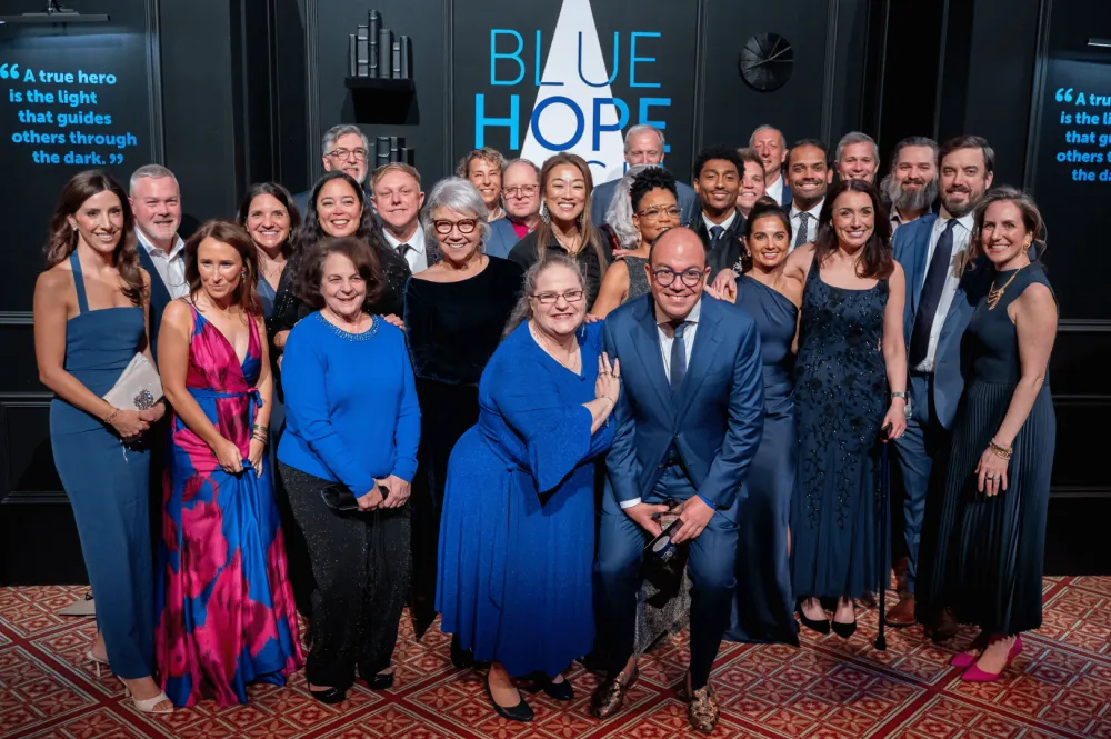 Guests capture memories and celebrate hope at the Blue Hope Bash photo booth.