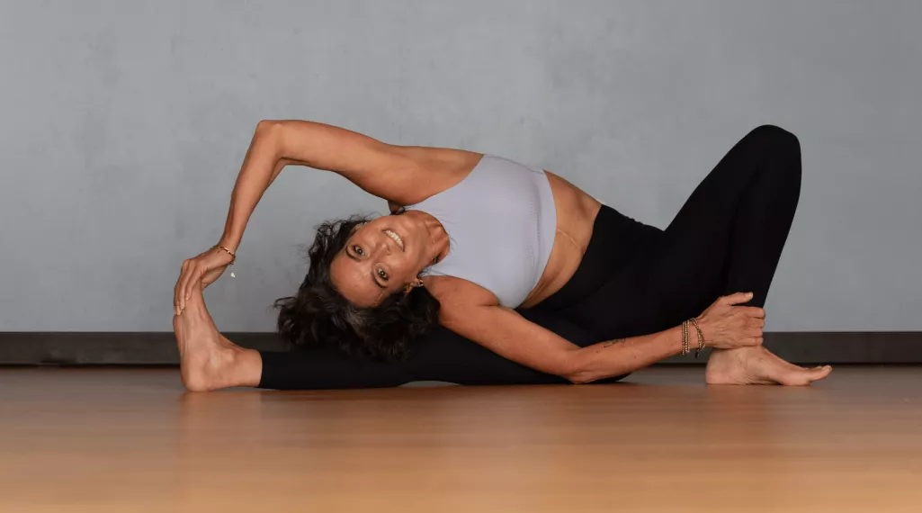 Hope performing a yoga pose