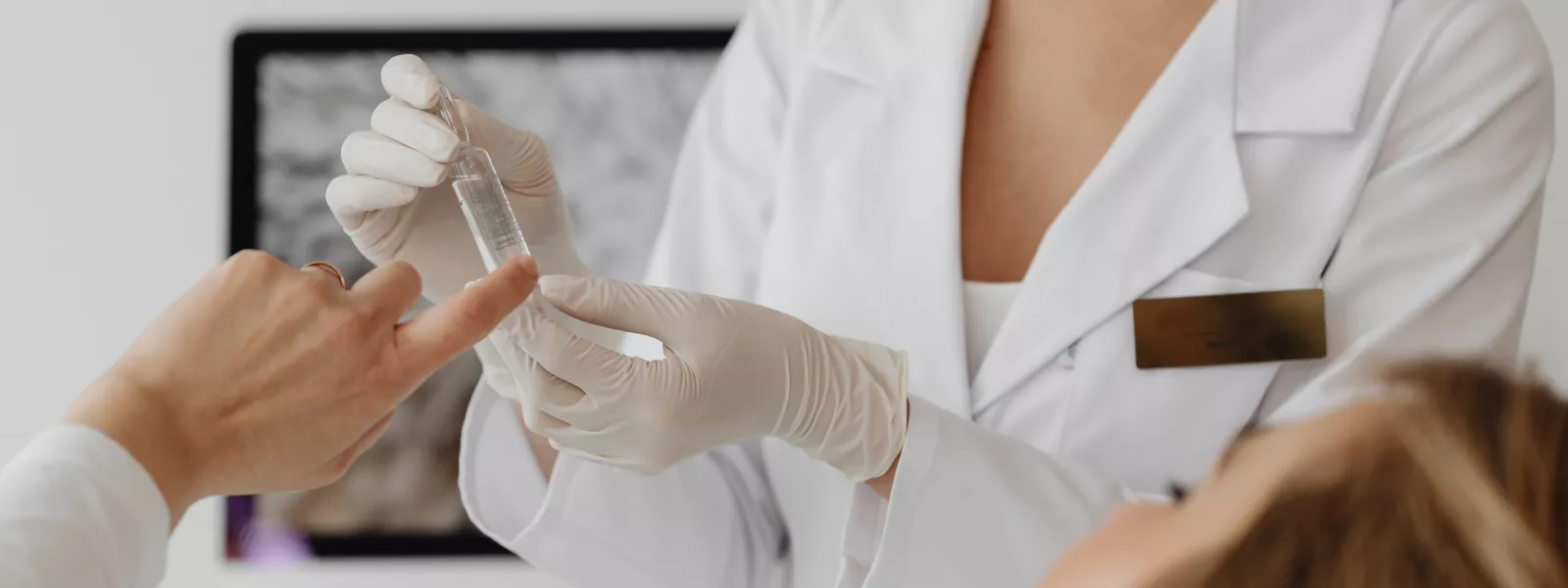 female provider shows medicine to patient