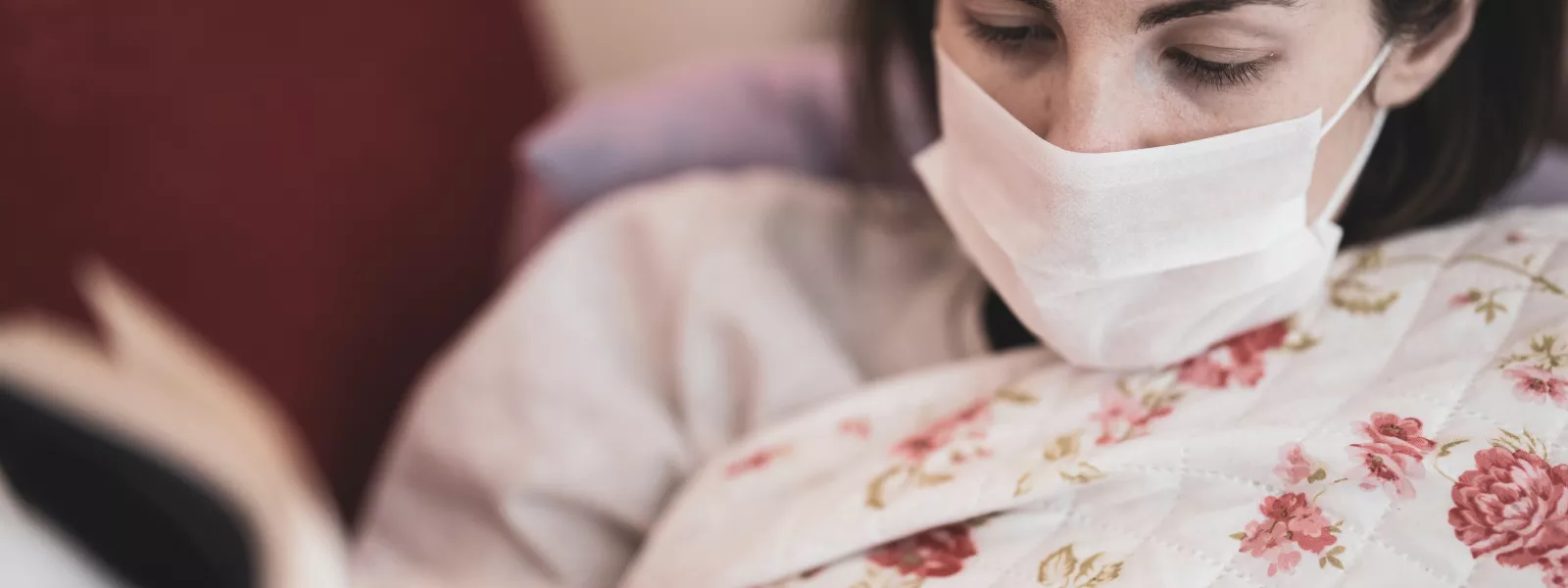 woman reads in waiting room