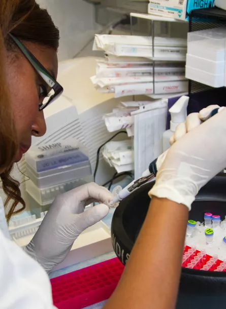 black female scientist with vials