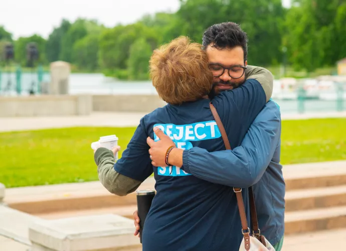 man and woman hugging