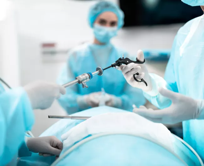 doctor holding scope in surgery