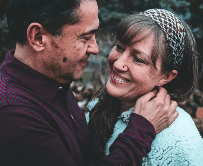 A man and woman share an intimate embrace