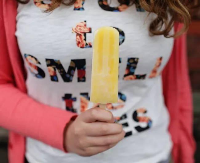 woman holding popiscle