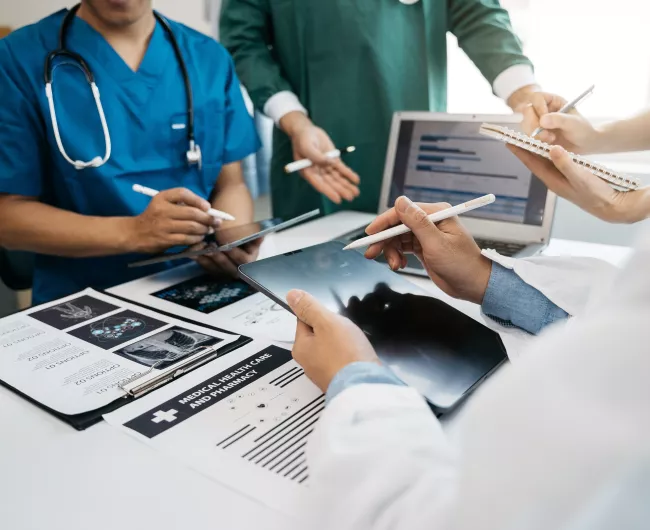 Medical team working on digital tablet healthcare doctor technology tablet using computer analyzed the results of medical reports at the hospital