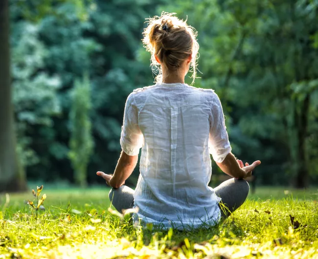 woman doing yoga pose in nature