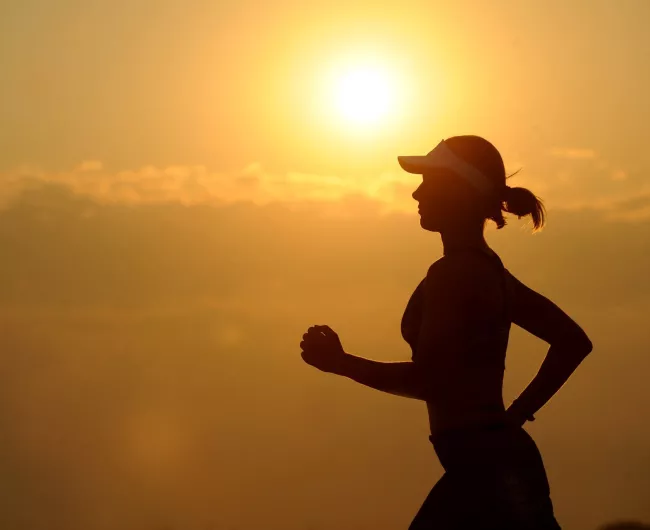 woman running at sunset