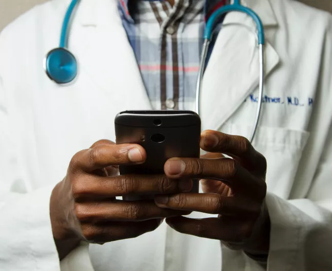 doctor holding phone