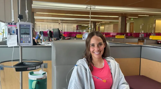 Smiling woman sitting in chair during treatment