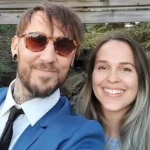 Dressy couple posing for selfie